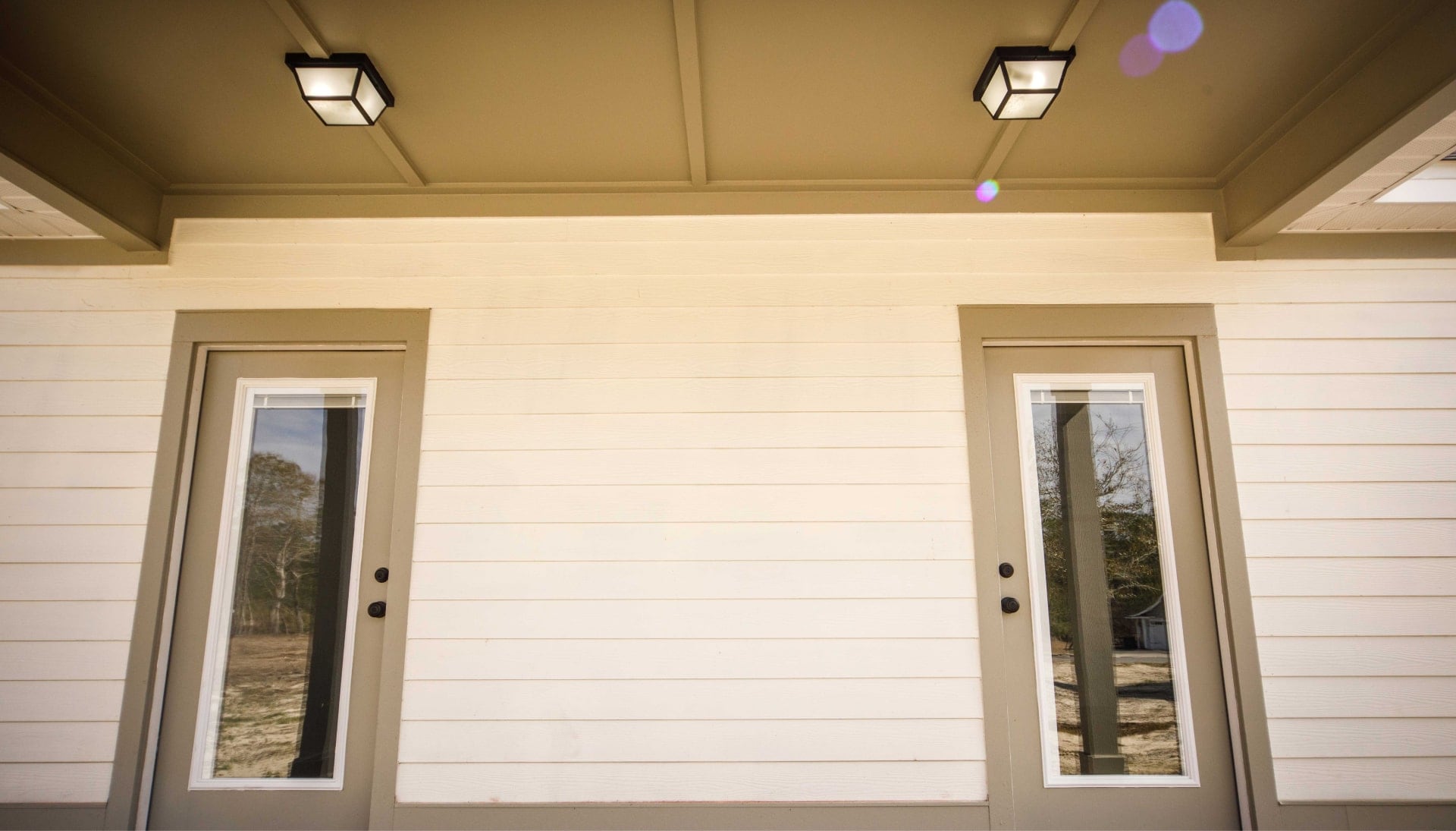 We offer siding services in Winston Salem, North Carolina. Hardie plank siding installation in a front entry way.